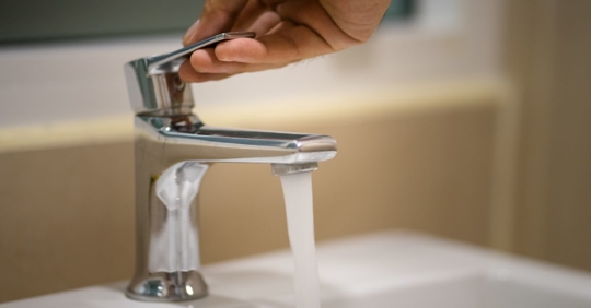 turning water faucet on